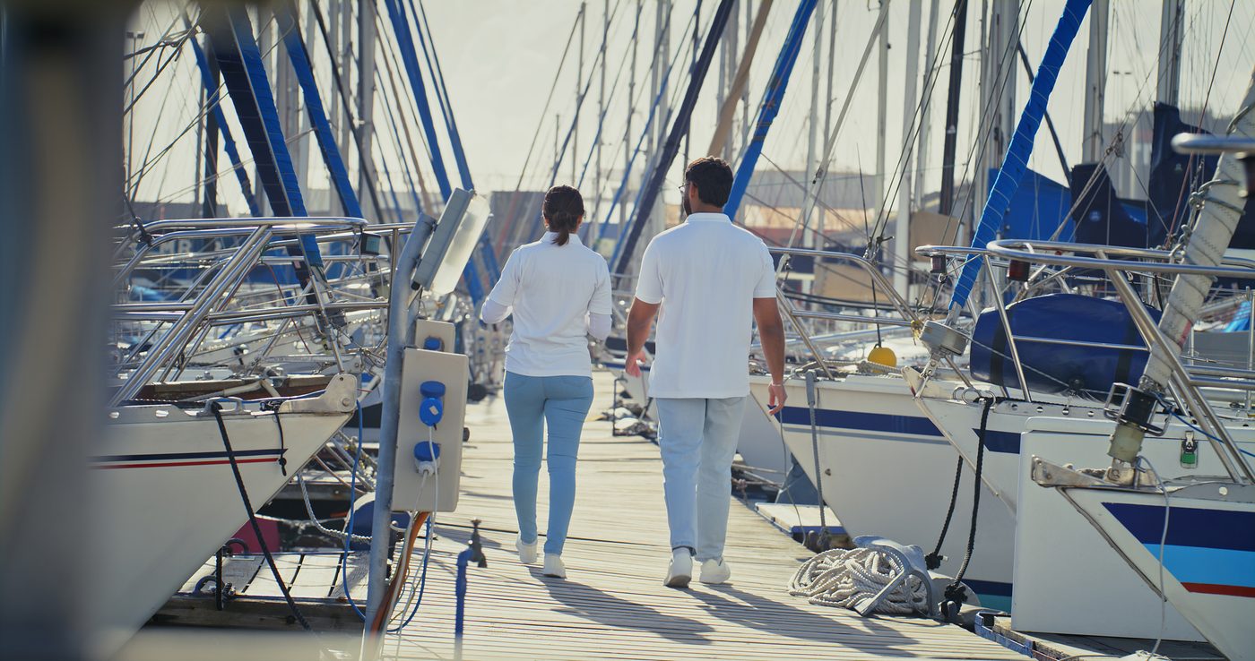 A couple walking the dock at the Bay City marina
