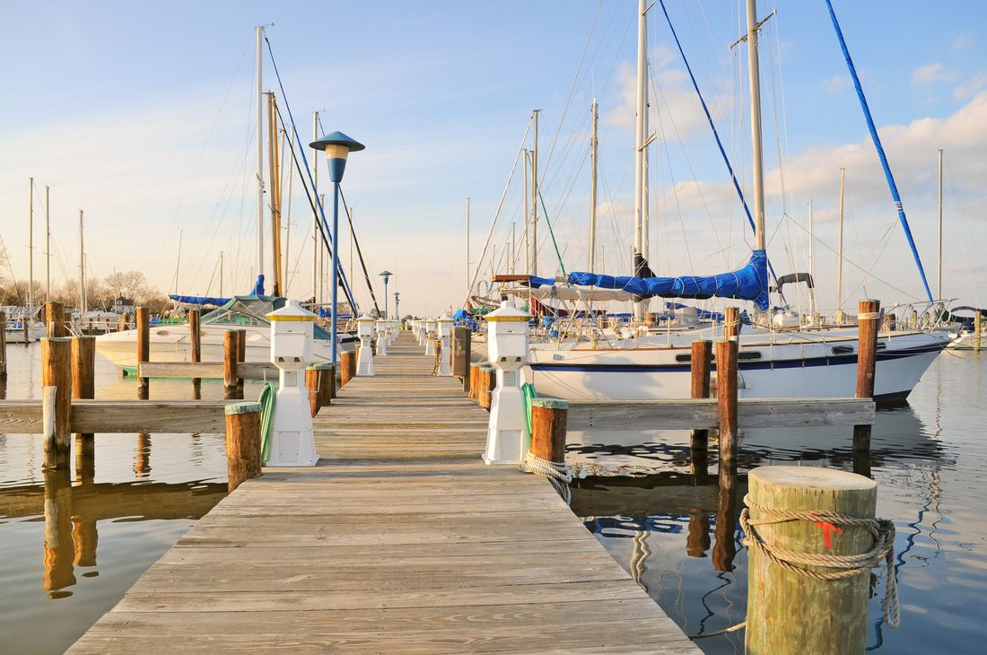 Sailboats at the dock in golden evening light